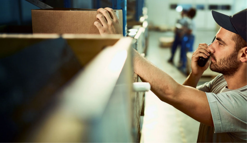 A technician or operations specialist in an industrial or technical environment who communicates by phone while managing equipment or machinery. Centralizing information and alerts improves team responsiveness, enables better coordination of interventions, and minimizes service interruptions.