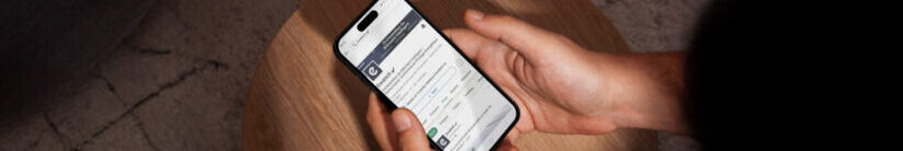 Someone viewing Ewattch's LinkedIn profile on a smartphone.