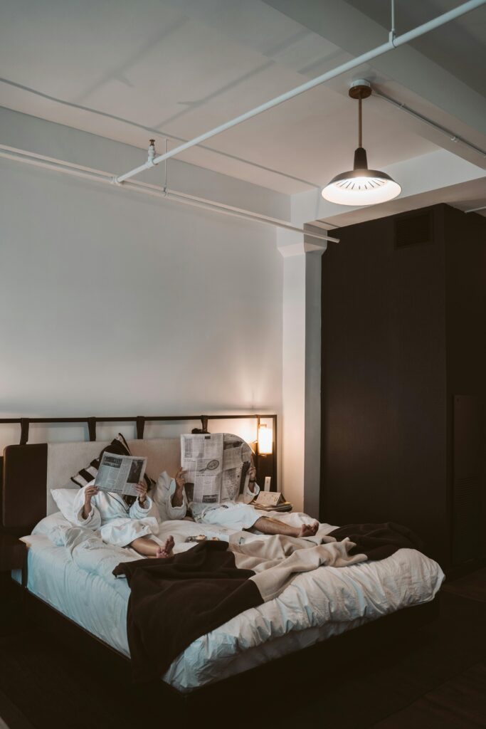 Guests relaxing in a comfortable, modern hotel room.