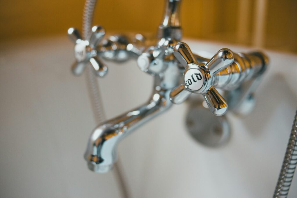 Image of a bathtub faucet in a hotel room